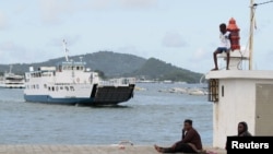 FILE - A boat arrives at Dzaoudzi on the Indian Ocean island of Mayotte, March 31, 2012. The Somali government said, Nov. 25, 2024, it will begin evacuating the survivors of two boats, carrying mostly Somali migrants, which capsized off the coast of Madagascar on Nov. 23.