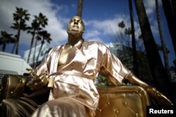 A statue of Harvey Weinstein on a casting couch made by artist Plastic Jesus is seen on Hollywood Boulevard near the Dolby Theatre during preparations for the Oscars in Hollywood, Los Angeles, California, March 1, 2018.