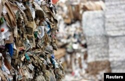 FILE - Bundled recyclables are seen outside the Pratt Industries corrugated box facility in the borough of Staten Island in New York, July 30, 2008. The facility converts waste paper collected from the streets of New York into 100 percent recycled corrugated boxes.