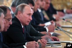Russian President Vladimir Putin attends talks with Saudi Arabia's King Salman, during their meeting at the Kremlin in Moscow, Oct. 5, 2017.