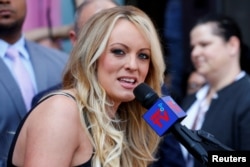 FILE - Stormy Daniels, the adult film actress entangeld in legal battles with U.S. President Donald Trump, speaks in West Hollywood, California, May 23, 2018.