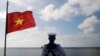 FILE - A Vietnamese naval soldier stands quard at Thuyen Chai island in the Spratly archipelago January 17, 2013. (Reuters)