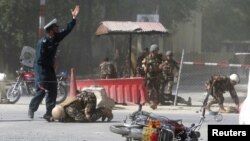 Taliban fighters patrol inside the city of Ghazni, southwest of Kabul, Afghanistan, and it&#39;s at least the 10th provincial capital the insurgents have taken in the past recently across the country.
