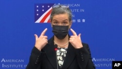 In this image taken from a video footage run by Taiwan's CTS via AP Video, Sandra Oudkirk, the new director of the American Institute in Taiwan, the de facto embassy, speaks during her first public news conference held in Taipei, Taiwan on Oct. 29, 2021.