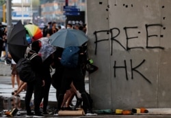 Anti-government demonstrators attend a protest march in Hong Kong, Oct. 20, 2019.