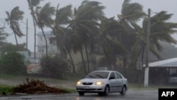 Badai tropis Laura saat melanda Guayama, Puerto Rico hari Sabtu (22/8). 