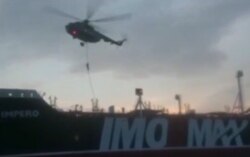 FILE - This image grab taken from a video provided by Iran's Revolutionary Guard official website via SEPAH News on July 20, 2019, allegedly shows Revolutionary Guard Corps boarding the British-flagged tanker Stena Impero in the Strait of Hormuz.