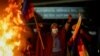 Fire burns as people celebrate along the streets after Luis Fernando Camacho, the governor of Santa Cruz and a prominent opposition leader, was detained by the Bolivian police in Santa Cruz de la Sierra, in El Alto, Bolivia, Dec. 28, 2022. 
