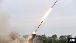 This picture taken on Aug. 27, 2024 and released from North Korea's official Korean Central News Agency (KCNA) via KNS on Aug. 28, 2024 shows a test-fire of the 240mm rocket artillery weapon system at an undisclosed location in North Korea.