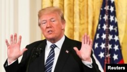 FILE - President Donald Trump delivers remarks at the White House in Washington, May 18, 2018. 