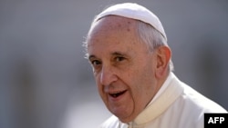 Pope Francis arrives in St. Peter's square at the Vatican on Sept. 9, 2015, for his weekly general audience.