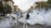 Members of firefighters wear protective face masks, amid fear of coronavirus disease (COVID-19), as they disinfect the streets, ahead of the Iranian New Year Nowruz, March 20, in Tehran, Iran March 18, 2020. Picture taken March 18, 2020. WANA (West…