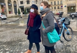 Opera singer Aurelie Magnier, left, worries how she'll make ends meet after unemployment benefits in France end in August. (Lisa Bryant/VOA)