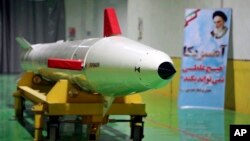 FILE - In this photo released Feb. 7, 2019, by Sepahnews, the website of the Iranian Revolutionary Guard, a Dezful surface-to-surface ballistic missile is displayed in an undisclosed location in Iran. 