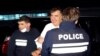 Tampak polisi Georgia membawa mantan presiden Mikheil Saakashvili setelah ia berhasil ditahan di Rustavi, georgia, pada 1 Oktober 2021. Saakashvili sebelumnya hidup dalam pengasingan di Ukraina selama delapan tahun. (Foto: Georgian Interior Ministry Press Service via AP)