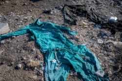 Garments traditional in Afghanistan and Pakistan are found in an area where refugees hide out in when they first enter Turkey, Aug. 11, 2021, in Van, Turkey. (Claire Thomas/VOA)