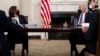 President Joe Biden speaks with Vice President Kamala Harris about the southern border during a meeting in the State Dining Room of the White House, March 24, 2021.