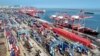 FILE - Shipping containers and gantry cranes are seen at a port in Lianyungang, in eastern China's Jiangsu province, on Aug. 7, 2024.