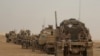 FILE - U.S. Marines prepare to build a military site in western Anbar, Iraq, Nov. 7, 2017. 