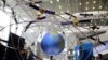 FILE - A model of the BeiDou navigation satellite system is seen at an exhibition to mark China's Space Day 2019 on April 24, in Changsha, Hunan province, China, April 23, 2019.