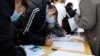 Job seekers visit a booth at a job fair in Beijing, China Feb. 16, 2023. 