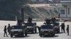 Thai Army soldiers stand on the Thai side of the border crossing in Chong Kaep town as they wait for the arrival of alleged victims from scam centres in Myanmar, in Phop Phra district in Thailand's Tak province, Feb. 12, 2025. 