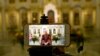 An Orthodox Church priest speaks to believers during a live broadcast in an empty church in Moscow, Russia, April 19, 2020. 