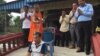 Kompong Cham Commune Chief Seang Chet received blessings from a Buddhist monk, Thursday, December 8, 2016, after serving seven months in prison. (Photo: Hul Reaksmey/VOA Khmer).​