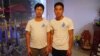 Brothers Trinh Ba Phuong (L) and Trinh Ba Tu pictured in a cafe the evening before their parents' trial, Hanoi, Nov. 24, 2014. (Marianne Brown for VOA)