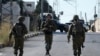 Tentara Israel memblokir jalan setelah tiga pria Palestina yang diduga bersenjata tewas di Nablus, Tepi Barat, Selasa, 25 Juli 2023. (AP/Majdi Mohammed)